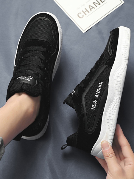 black and white rubber shoes