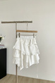 Summer New Irregular Sweet Splicing Lace Edge Hollow Cake Skirt Design Hot Girl Heavy Short Skirt Female in White